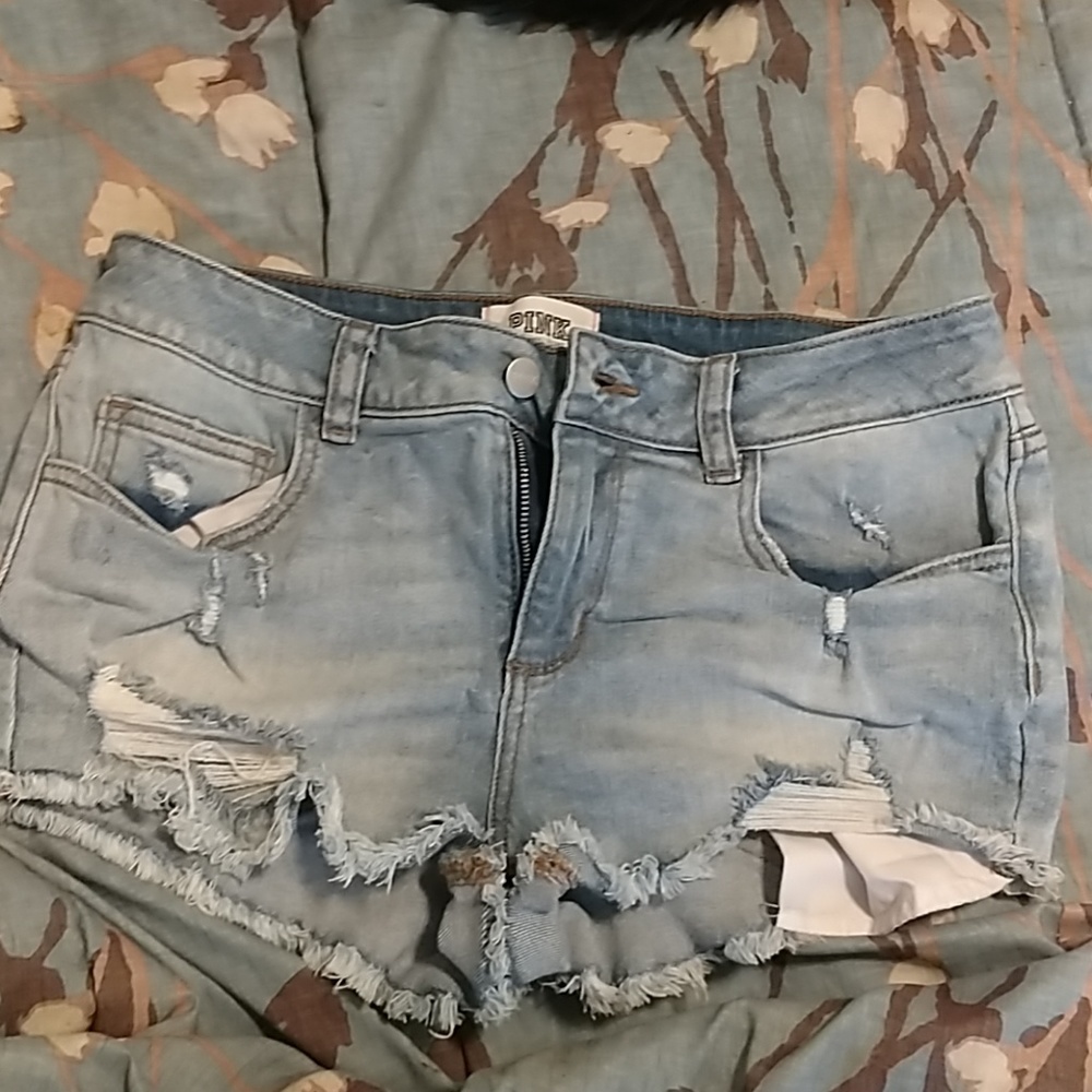 Pink distressed denim shorts